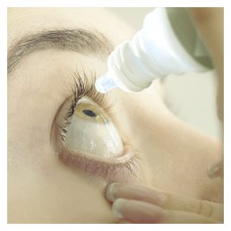 Close-up of an eye receiving drops from a dropper, emphasising hydration or relief for dry eyes.
